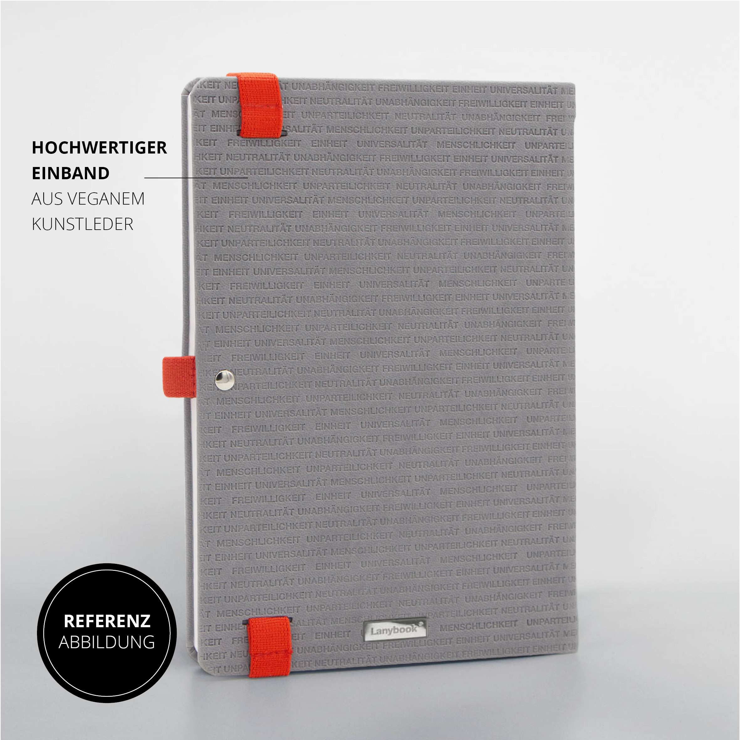 Notizbuch-Rückseite mit geprägtem Textmuster, roten Lanybandschlaufen und Metallelement.