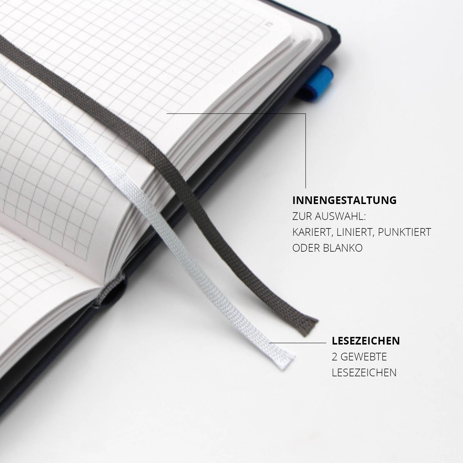 Innenseiten des Lanybook® mit karierter Gestaltung und zwei gewebten Lesezeichen für optimale Organisation.