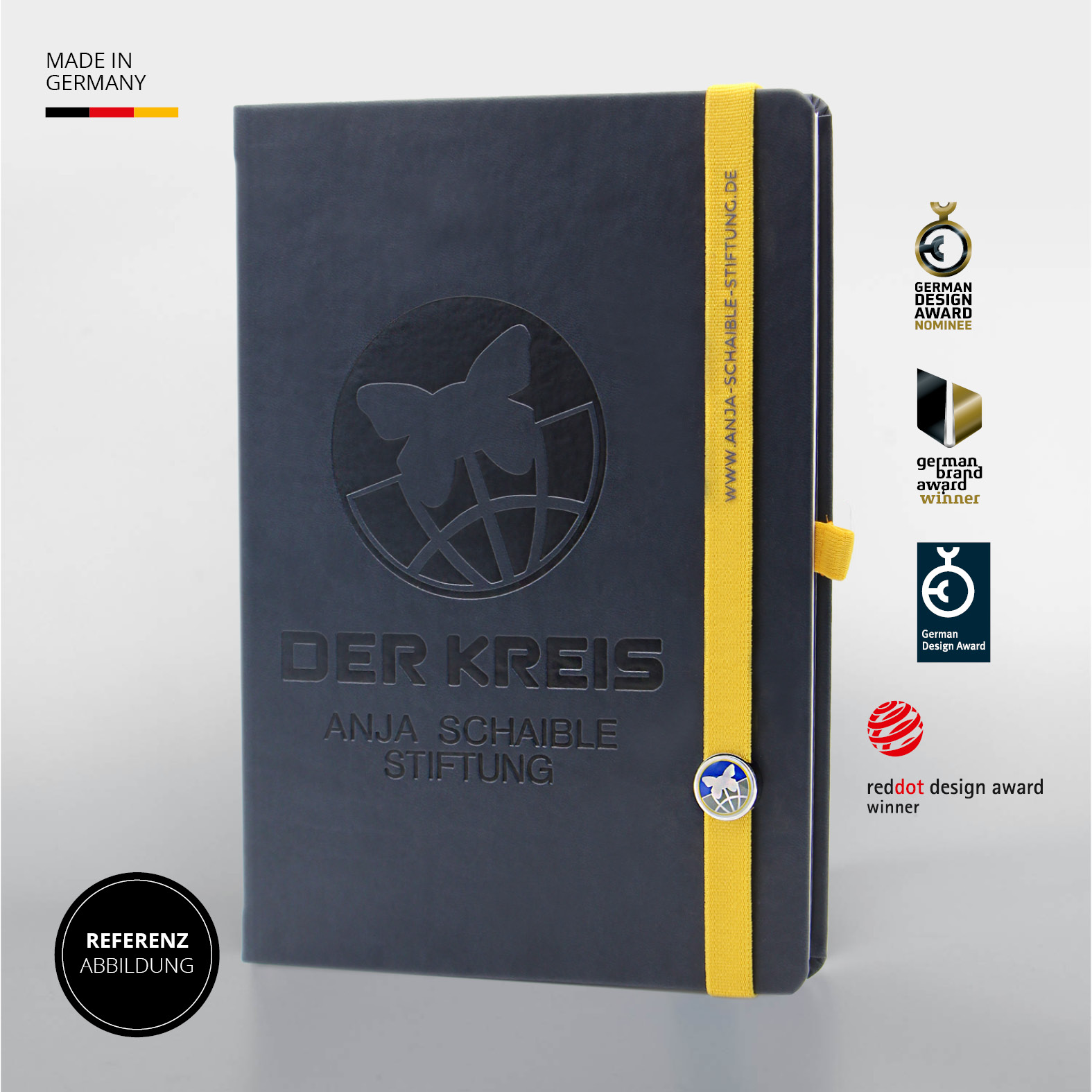 Dunkelblaues Lanybook® mit gelbem Lanyband®, Logo-Prägung „DER KREIS – Anja Schaible Stiftung“ und mehreren Designauszeichnungen am rechten Rand, darunter der German Design Award und der Red Dot Design Award.