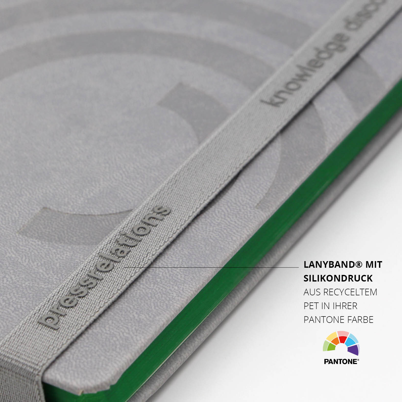 Graues Lanyband® mit hochwertigem Silikondruck und dezenter Markenbotschaft