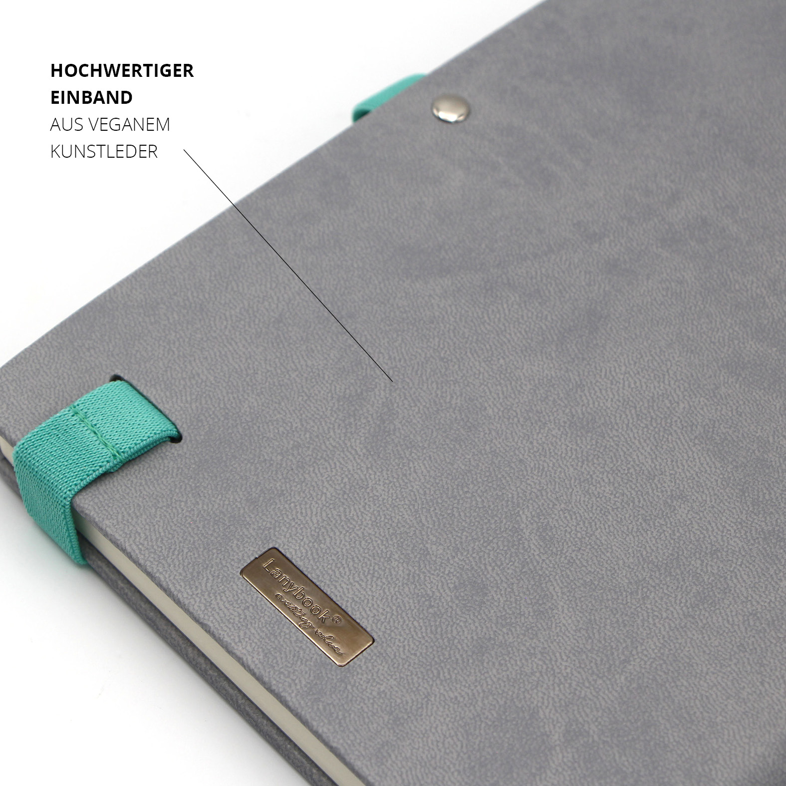 Nahaufnahme des Einbands aus veganem Kunstleder in Grau mit türkisfarbenen Lanyband-Halterungen und Lanybook® Metall-Logo.