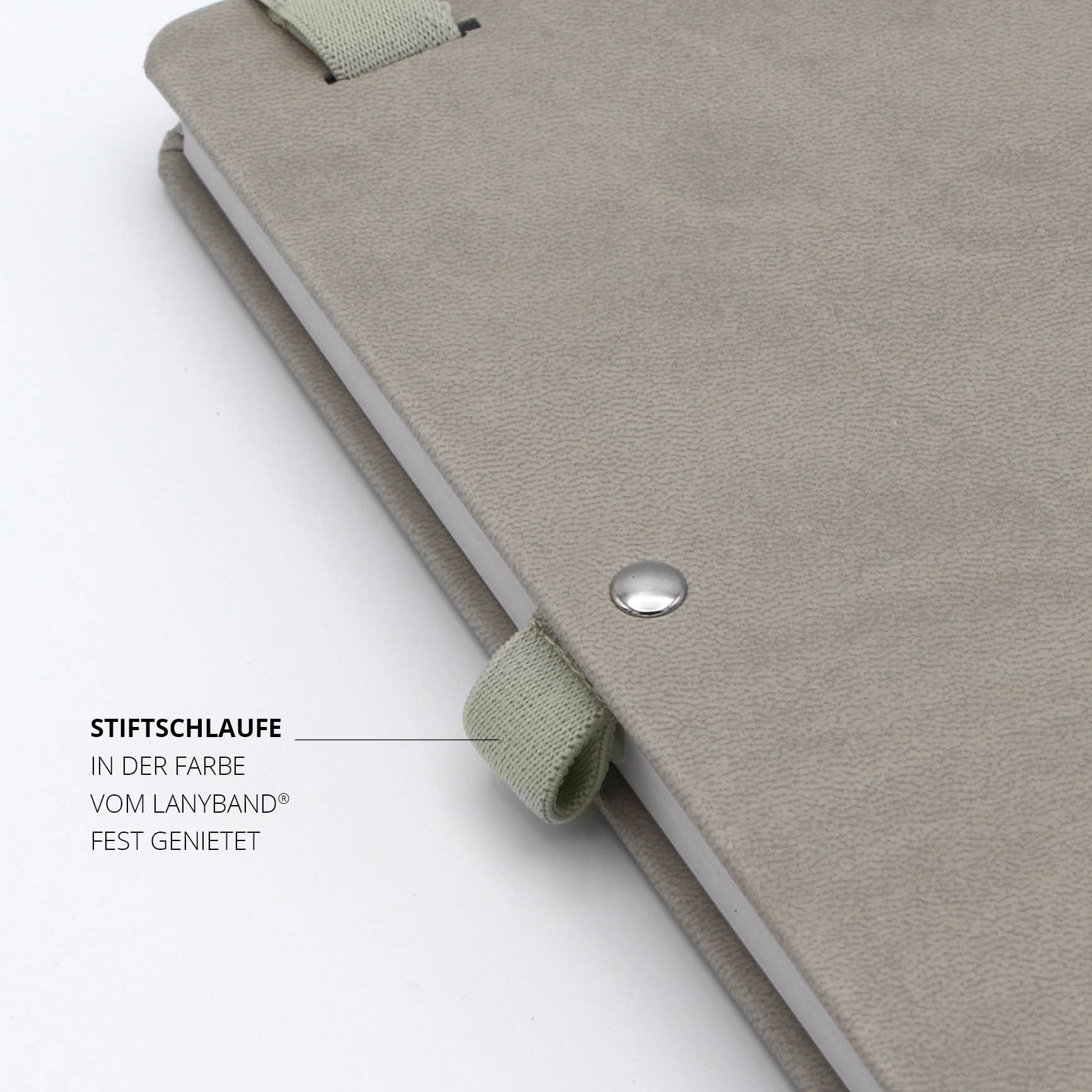  Individuelles Hyundai-Notizbuch mit stabiler Stiftschlaufe – Detailaufnahme der beigen Stiftschlaufe aus recyceltem PET, fest vernietet für hohe Stabilität.