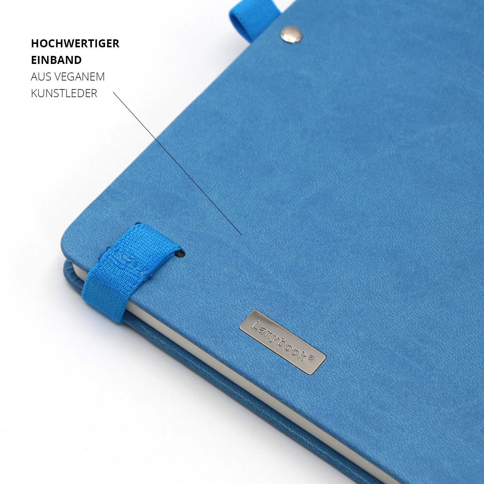 Detailaufnahme des hochwertigen blauen Kunstledereinbands mit eingeprägtem Spezi-Logo und fest vernieteter Stiftschlaufe.