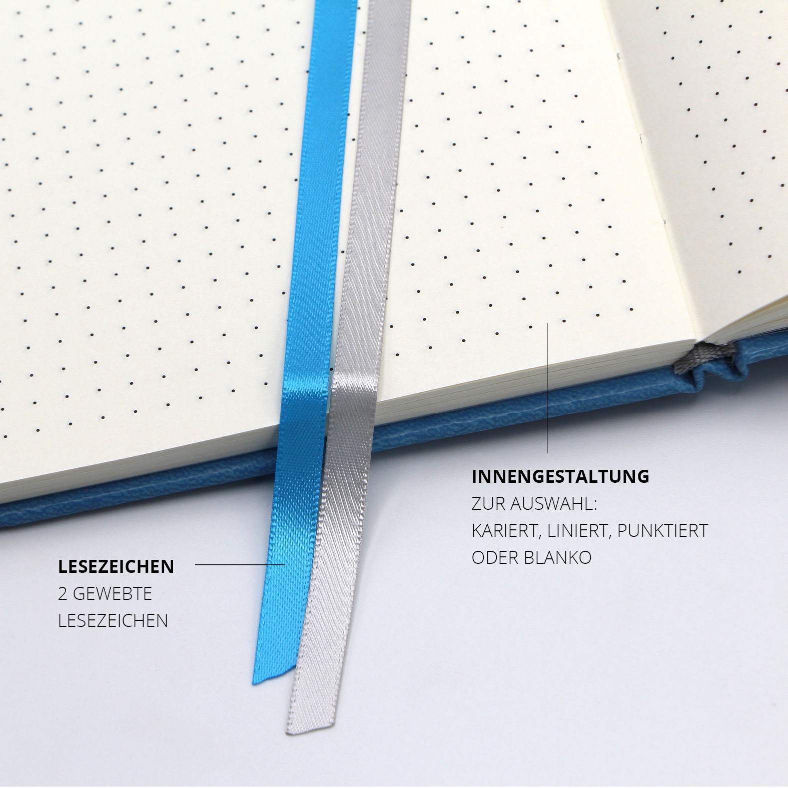 Zwei gewebte Lesezeichen in Blau und Silber in einem punktierten Notizbuch – zur einfachen Organisation mehrerer Themen.